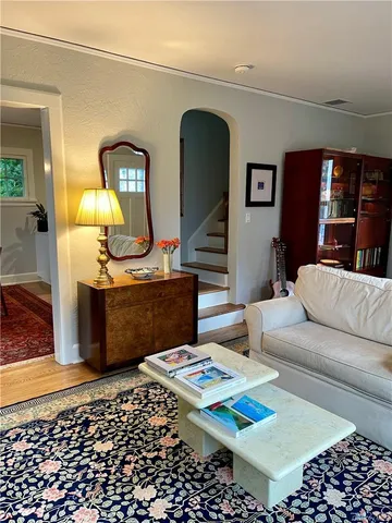 a living room with furniture rug and window