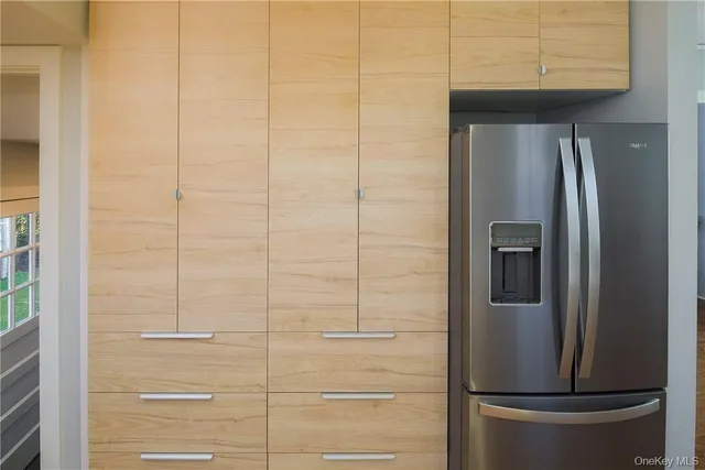 a bathroom with a refrigerator