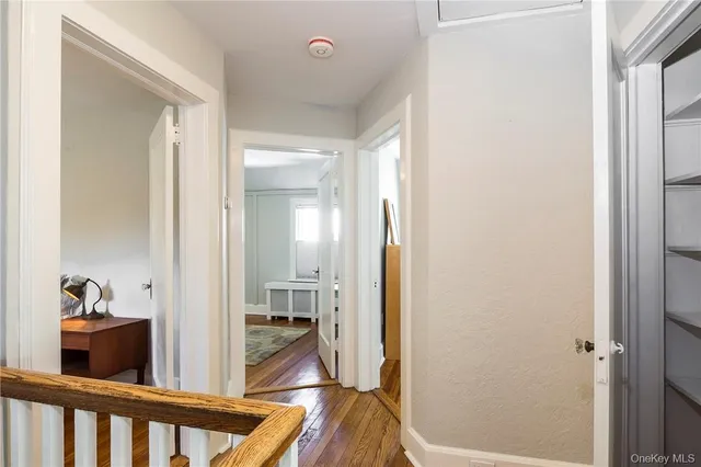a view of a hallway and a livingroom and a hallway