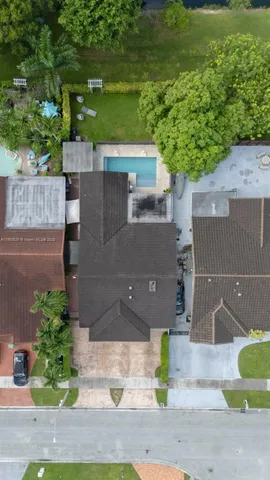 an aerial view of a house with yard