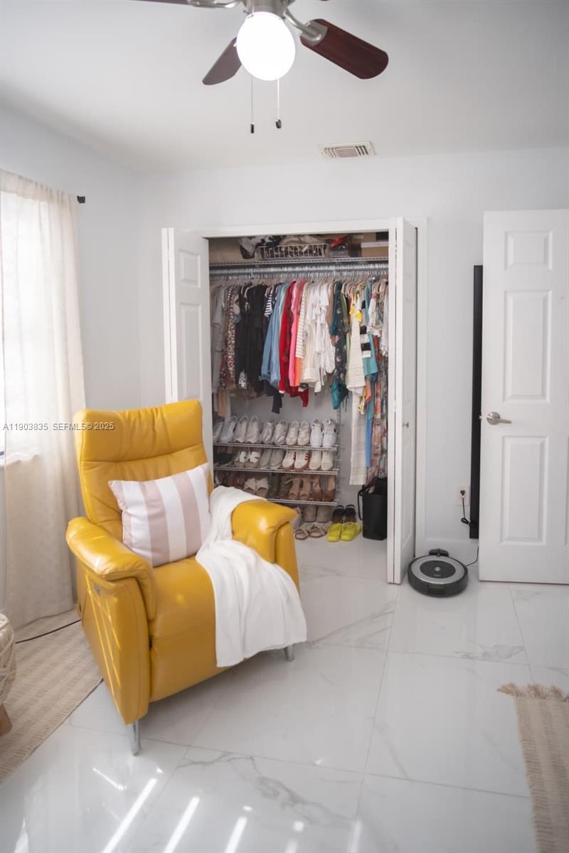 15076 Southwest 63rd Terrace Miami, FL 33193 - Photo 17 of 40 a living room with furniture and a flat screen tv
