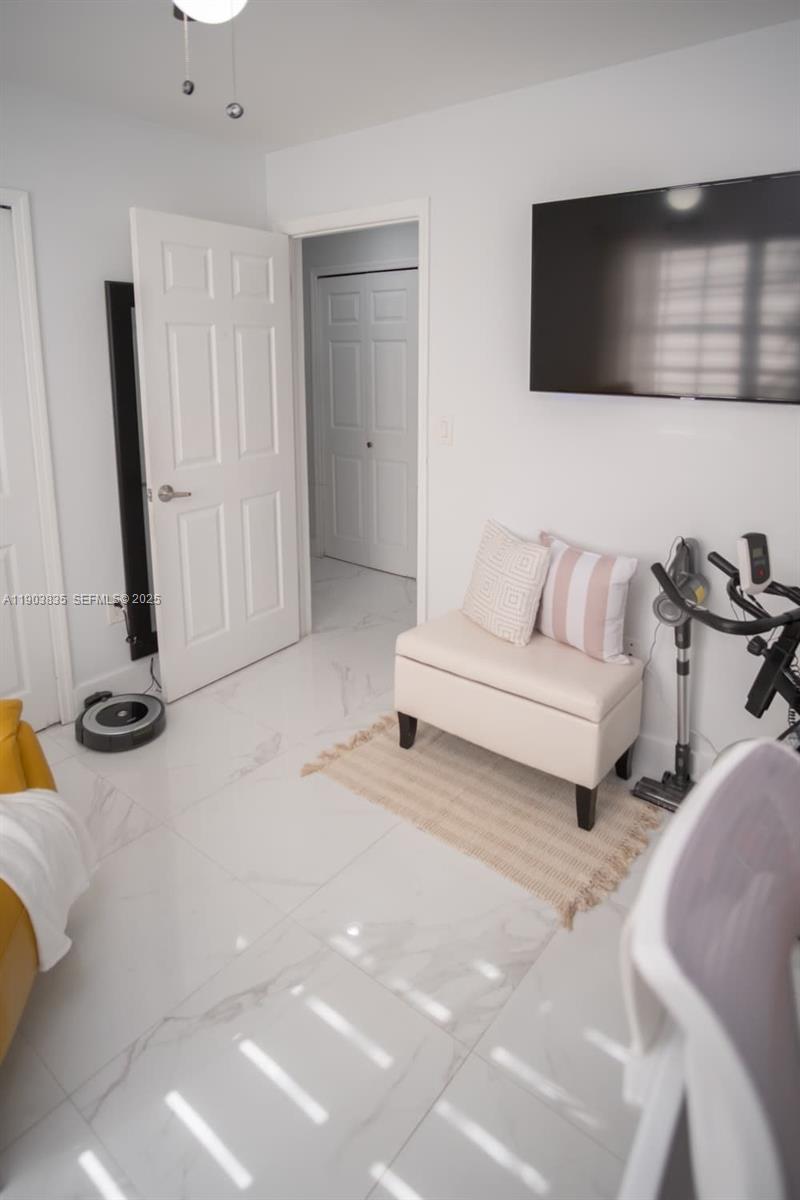 15076 Southwest 63rd Terrace Miami, FL 33193 - Photo 18 of 40 a living room with furniture and a flat screen tv