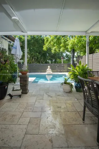 a outdoor dining space with furniture and outdoor view