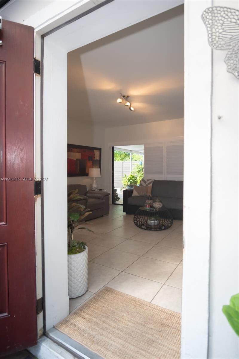 15076 Southwest 63rd Terrace Miami, FL 33193 - Photo 23 of 40 a view of a entryway door and living room