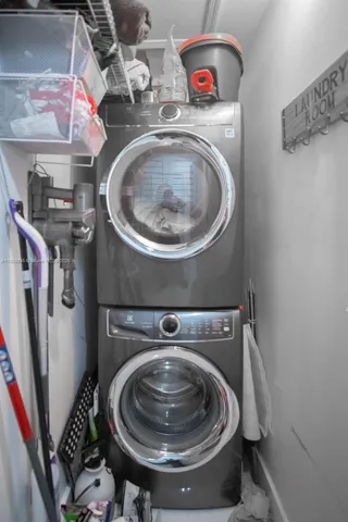 a view of a patio with potted plants and palm trees