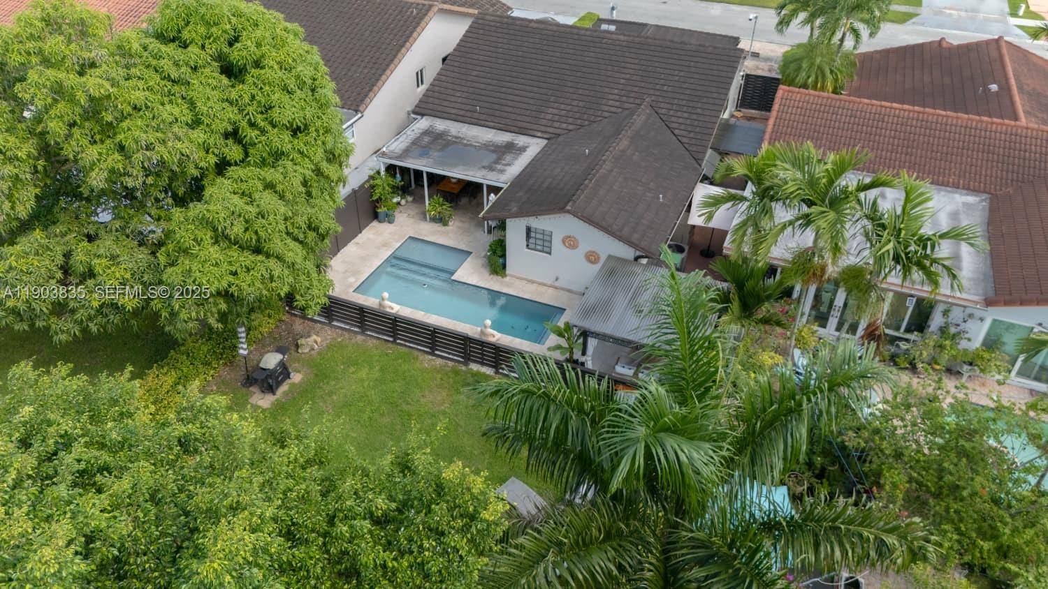 15076 Southwest 63rd Terrace Miami, FL 33193 - Photo 35 of 40 an aerial view of residential house with outdoor space and trees all around