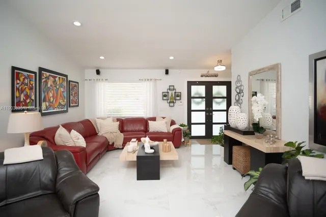 a kitchen with a refrigerator and a stove top oven