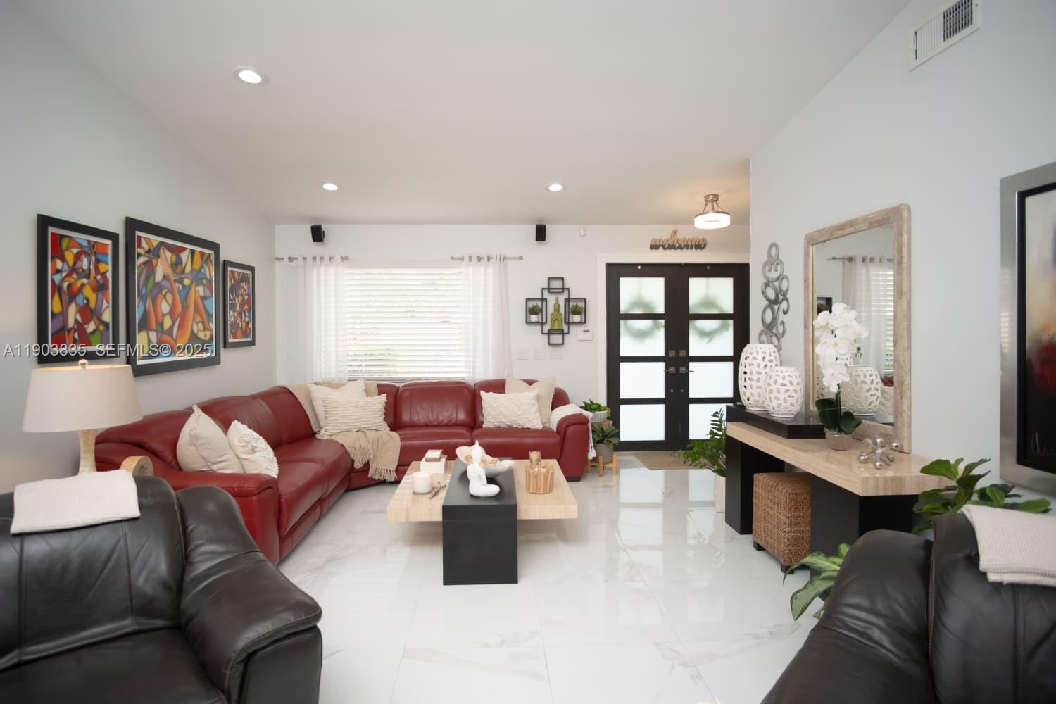 15076 Southwest 63rd Terrace Miami, FL 33193 - Photo 7 of 40 a living room with furniture and a large window
