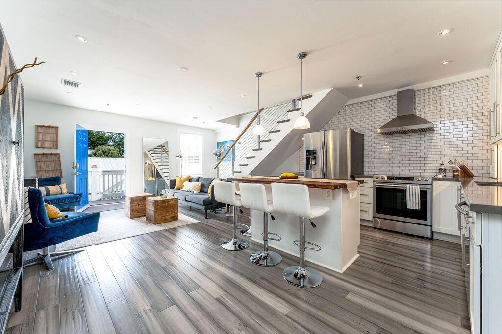 1014 Truman Avenue, Unit 3 Key West, FL 33040 - Photo 2 of 14 a living room with lots of furniture and a wooden floor