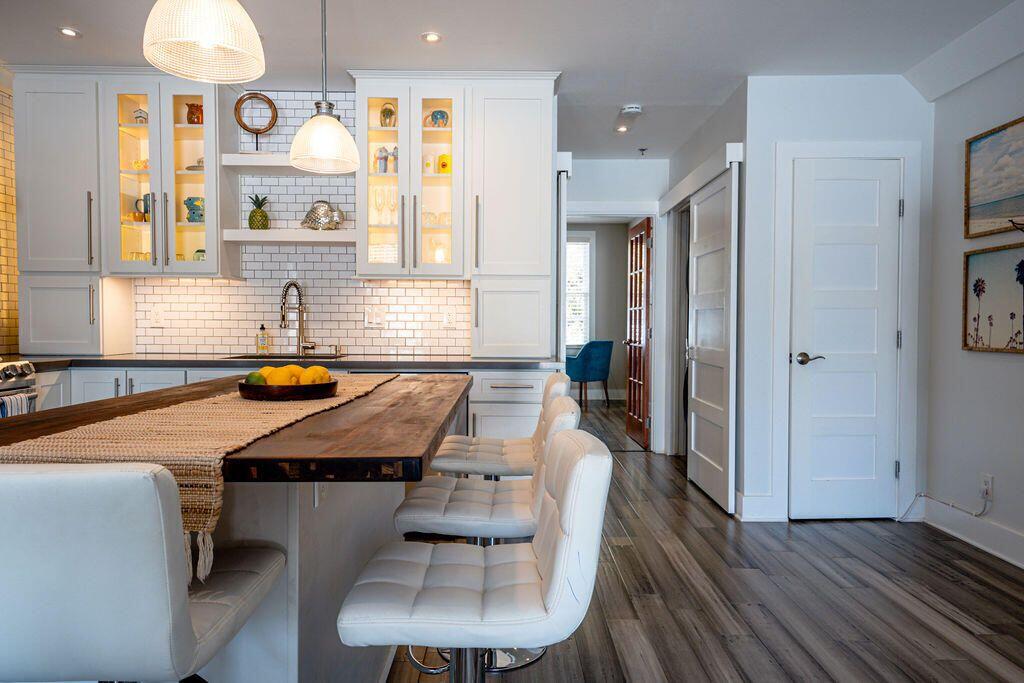 1014 Truman Avenue, Unit 3 Key West, FL 33040 - Photo 3 of 14 a room with pool table and windows