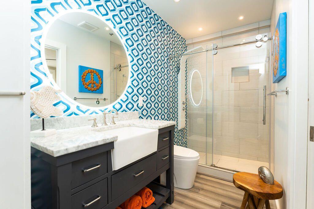 1014 Truman Avenue, Unit 3 Key West, FL 33040 - Photo 8 of 14 a bathroom with a sink a toilet and shower