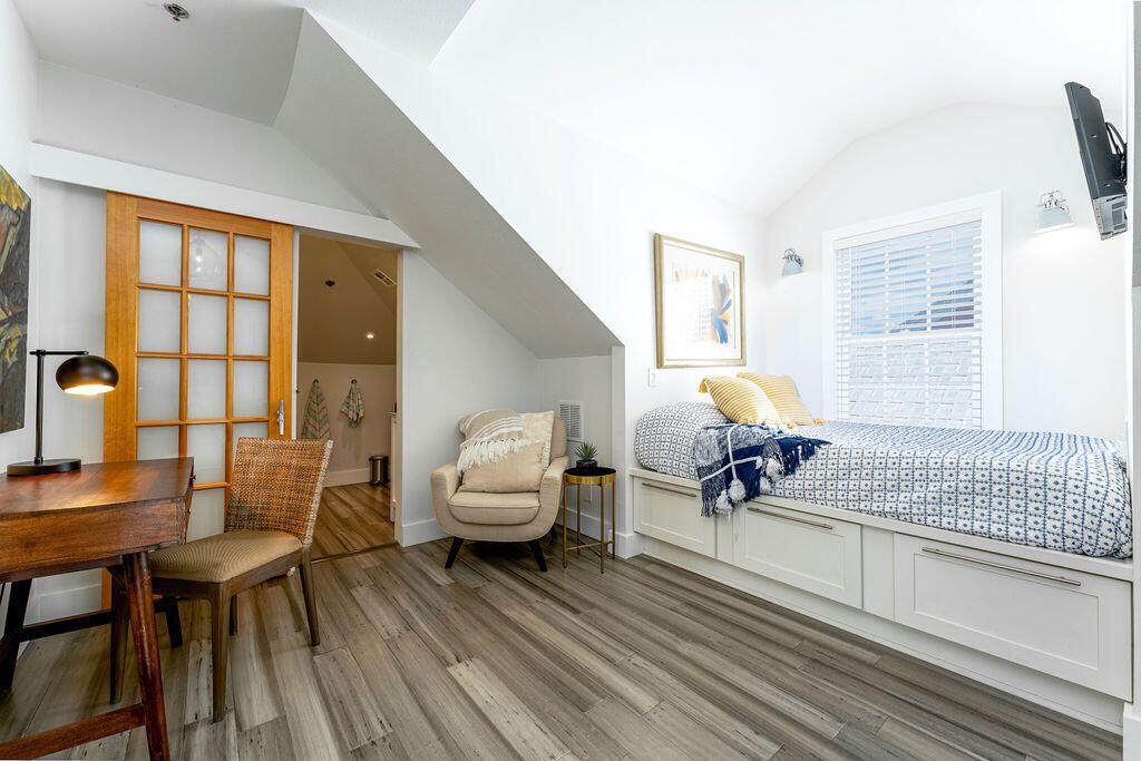 1014 Truman Avenue, Unit 3 Key West, FL 33040 - Photo 9 of 14 a living room filled with furniture and a table