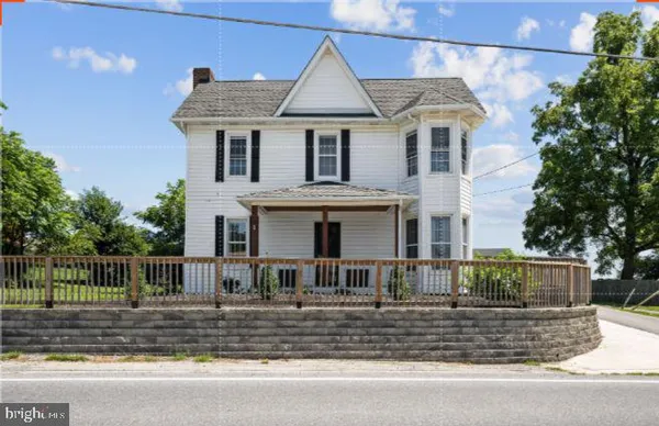 a front view of a house with garage
