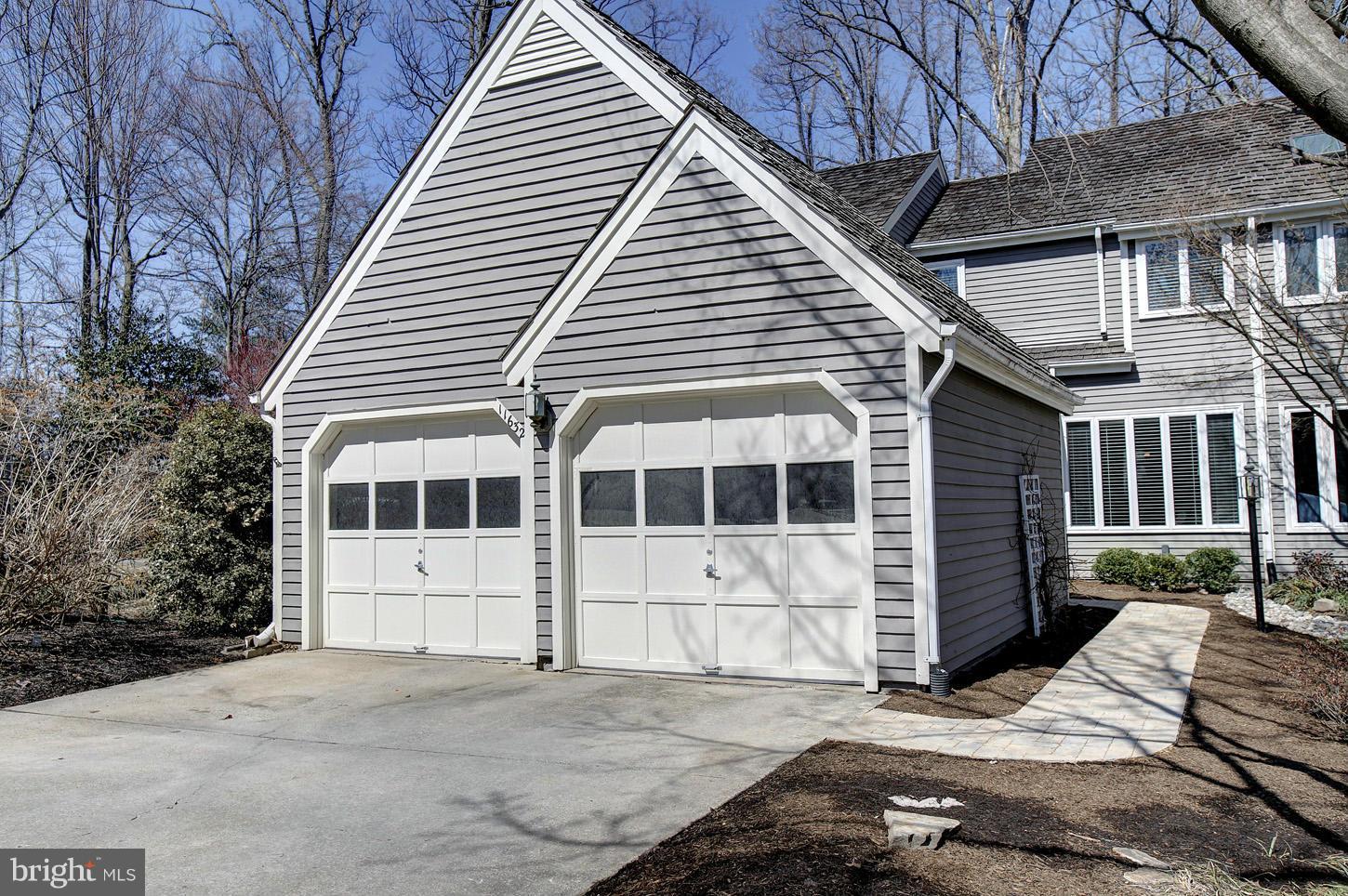 11632 Chapel Cross Way Reston, VA 20194 - Photo 2 of 30 a view of a white house with a large windows