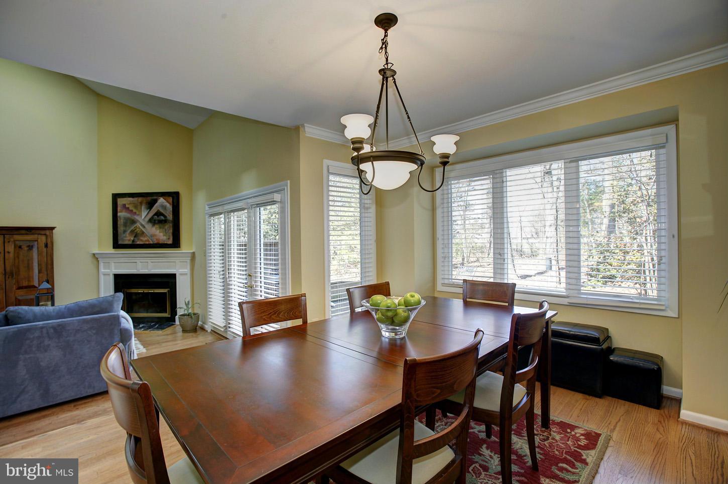 11632 Chapel Cross Way Reston, VA 20194 - Photo 11 of 30 a view of a dining room with furniture window and wooden floor