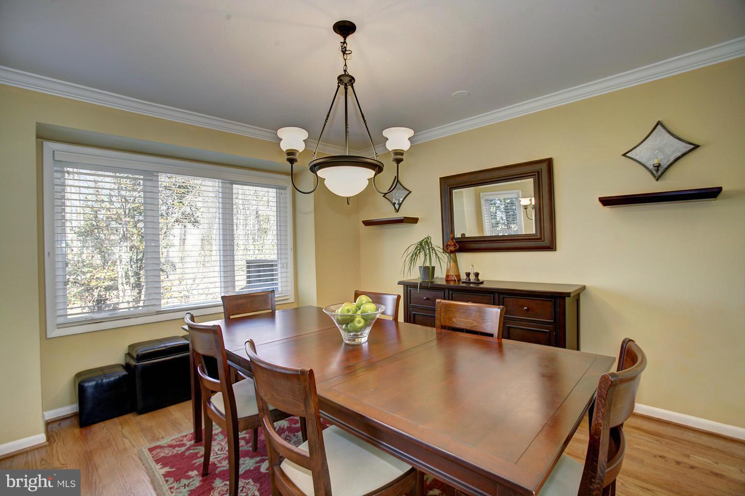 11632 Chapel Cross Way Reston, VA 20194 - Photo 12 of 30 a view of a dining room with furniture window and wooden floor
