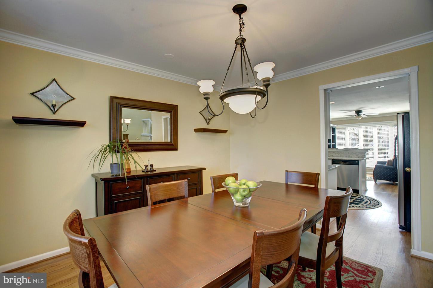 11632 Chapel Cross Way Reston, VA 20194 - Photo 13 of 30 a view of a dining room with a table and chairs