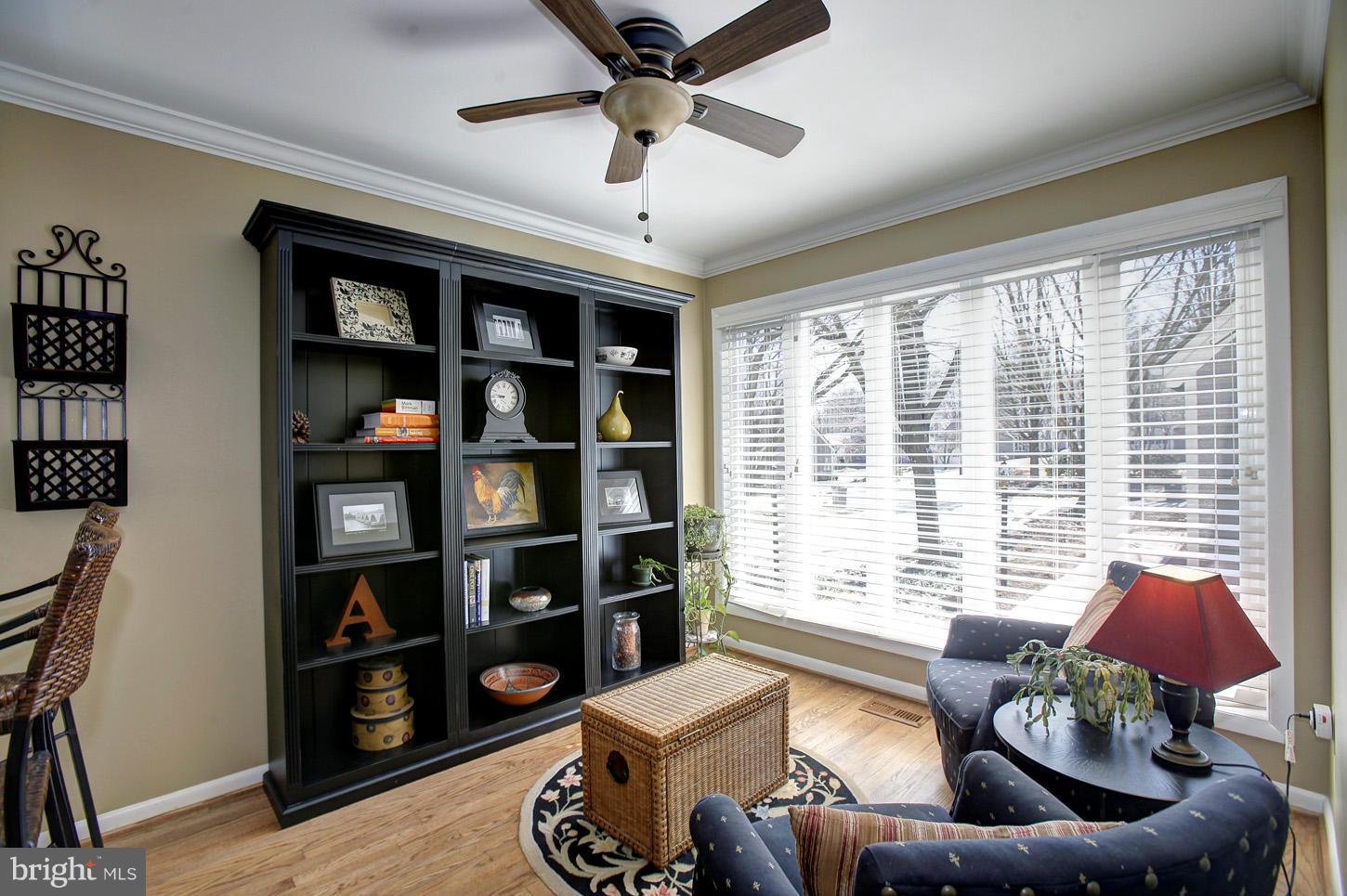11632 Chapel Cross Way Reston, VA 20194 - Photo 19 of 30 a living room with furniture and a large window