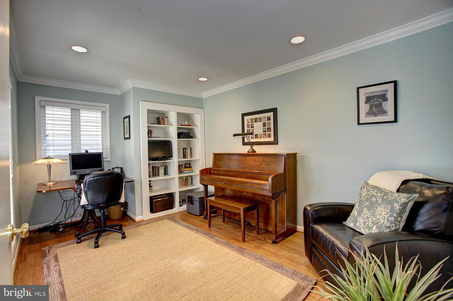 11632 Chapel Cross Way Reston, VA 20194 - Photo 20 of 30 a room with furniture a piano and wooden floor