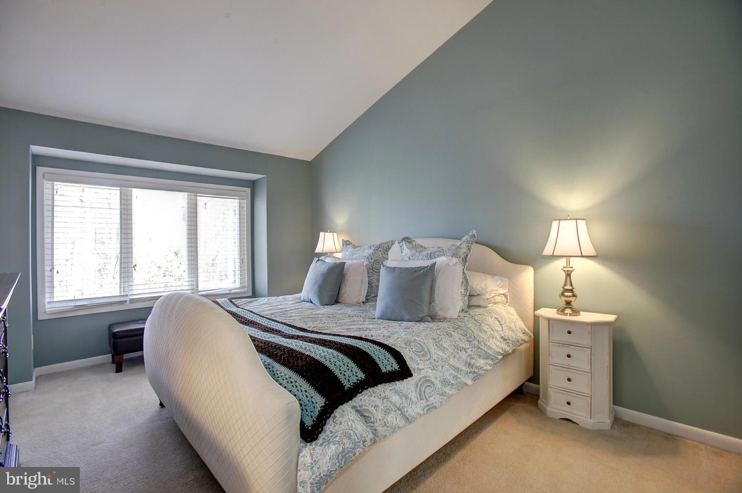 11632 Chapel Cross Way Reston, VA 20194 - Photo 22 of 30 a large bed sitting in a bedroom next to a window