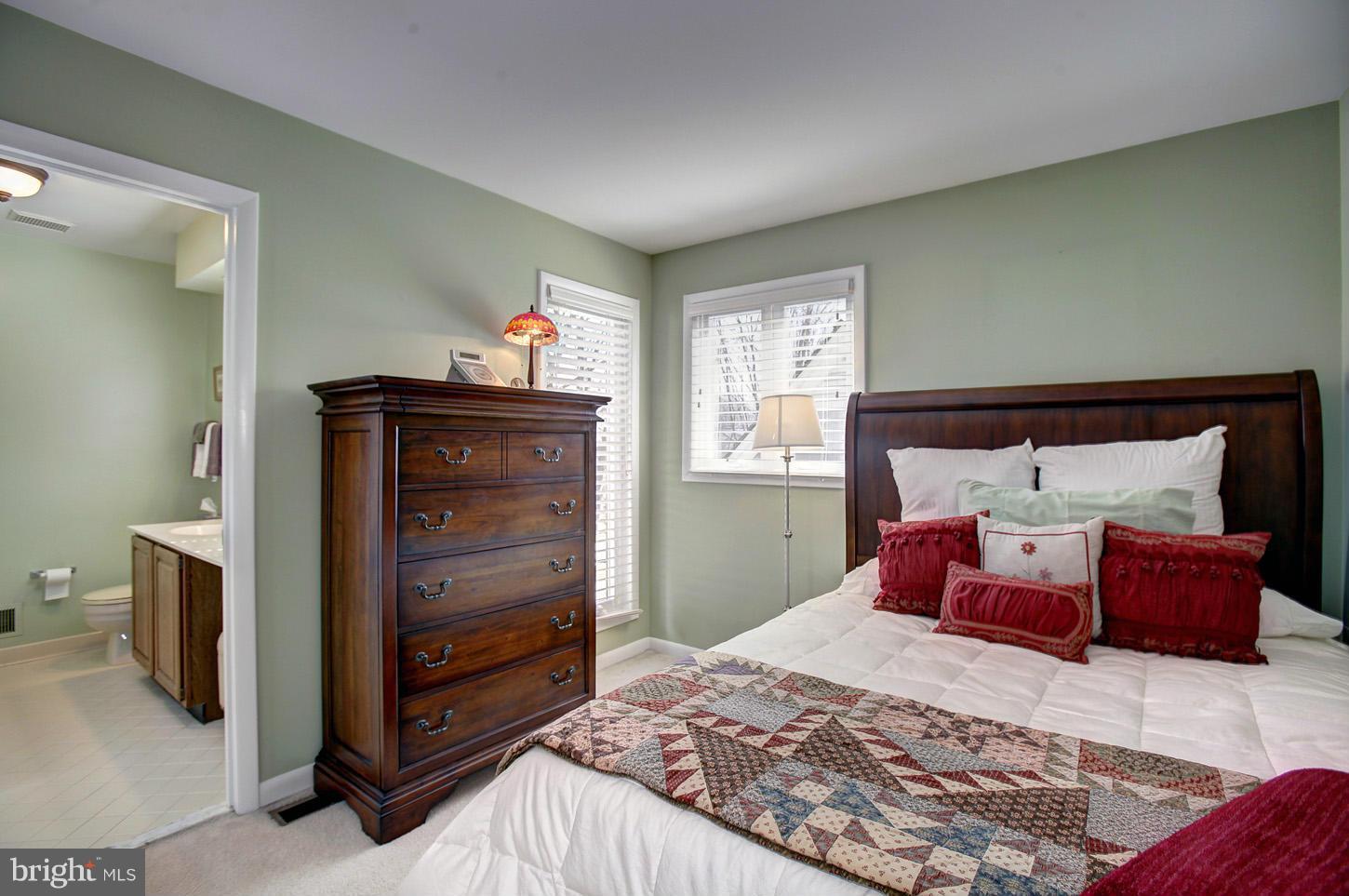 11632 Chapel Cross Way Reston, VA 20194 - Photo 24 of 30 a bedroom with a bed and window