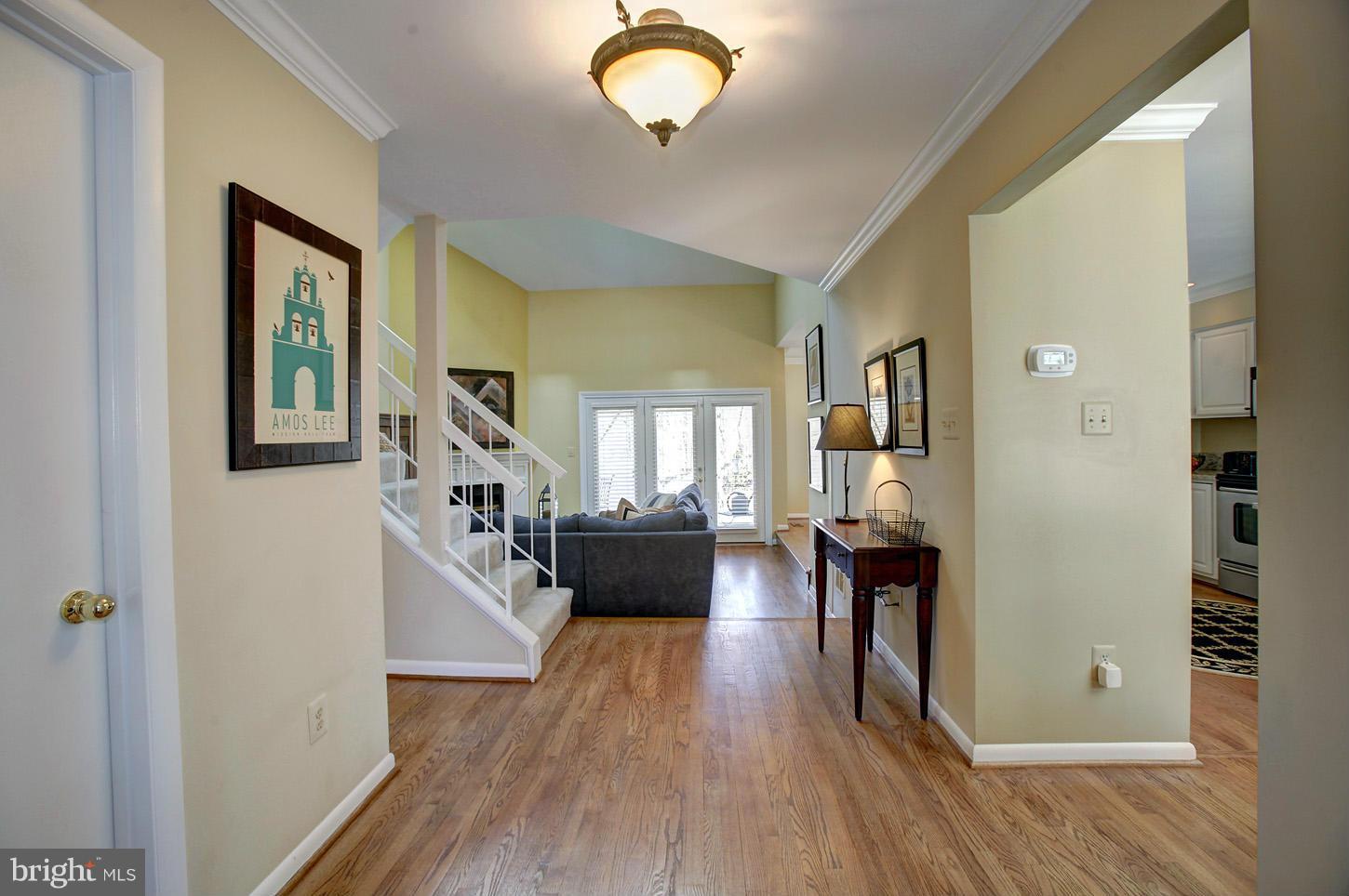 11632 Chapel Cross Way Reston, VA 20194 - Photo 4 of 30 a living room with furniture and a wooden floor