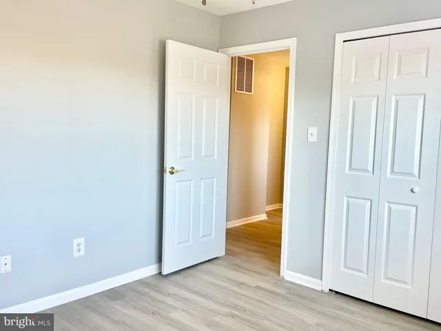 a view of a bathroom with wooden floor
