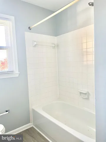 a bathroom with a shower and a bathtub