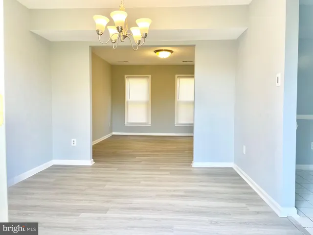 a view of livingroom and kitchen with wooden floor