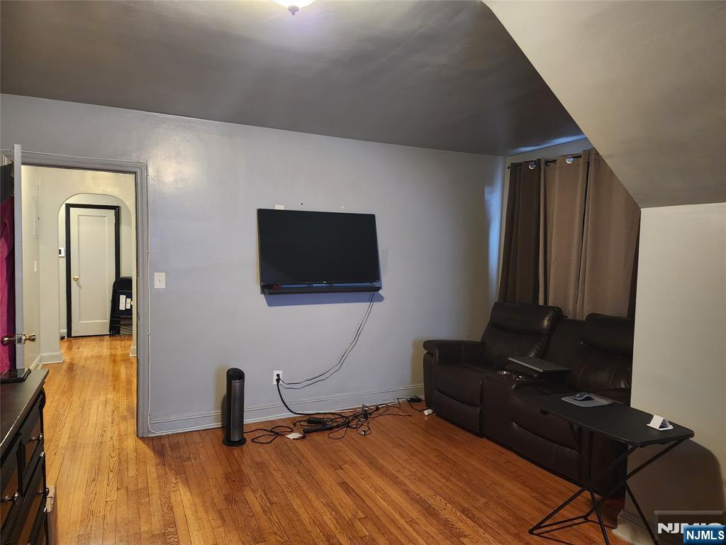 490 Beverly Road, Unit B6 Teaneck, NJ 07666 - Photo 13 of 17 a bedroom with a bed and a flat screen tv