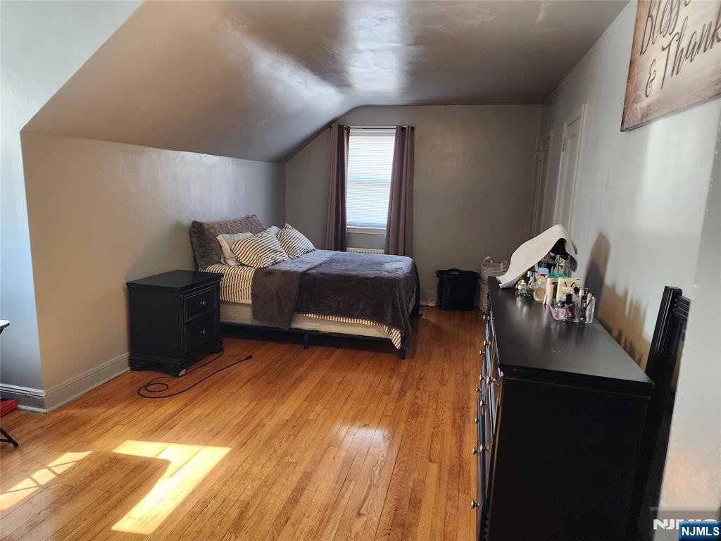 490 Beverly Road, Unit B6 Teaneck, NJ 07666 - Photo 17 of 17 a living room with furniture and a wooden floor