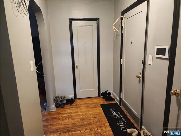 a view of bedroom with a bed and a mirror