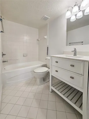 a bathroom with a sink a toilet and bathtub