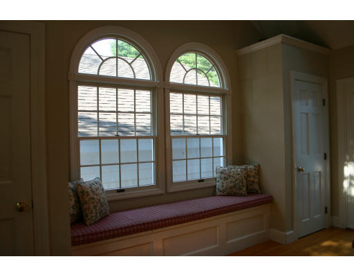 25 Main Street Boxford, MA 01921 - Photo 3 of 5 a living room with a large window and a wooden floor