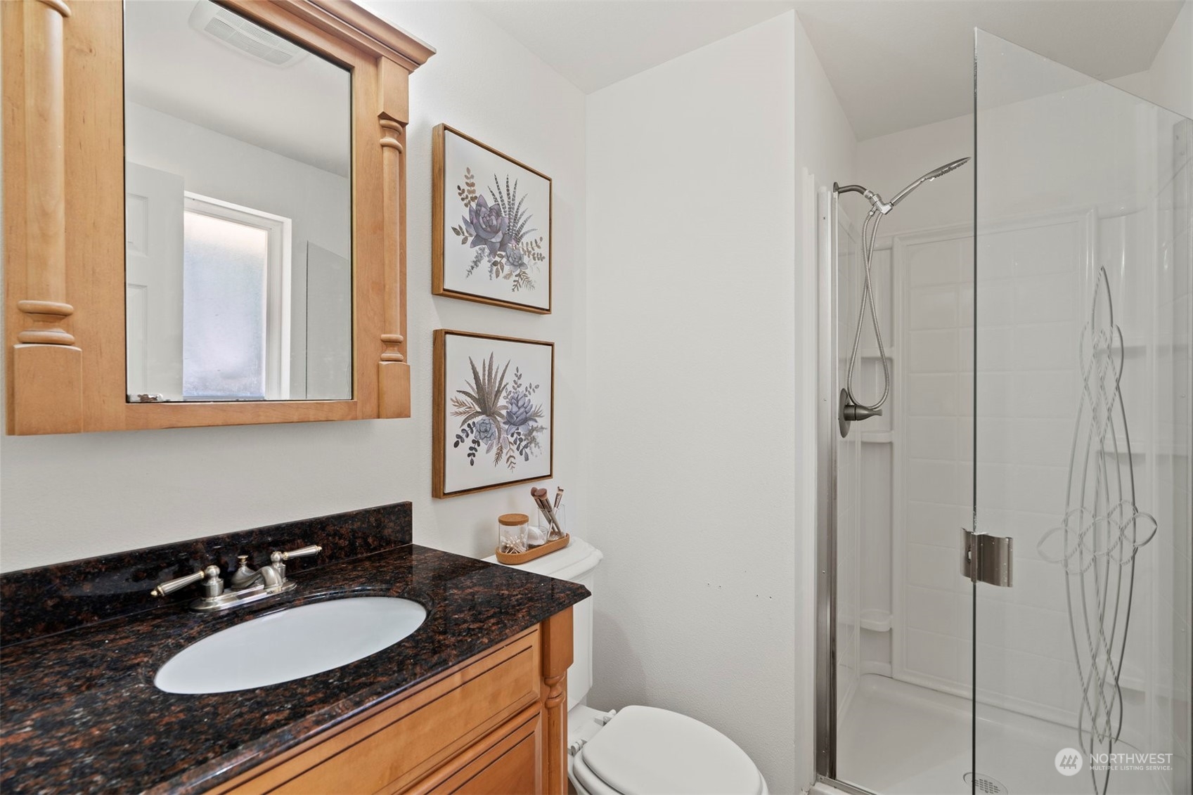 10033 Northeast 204th Street Bothell, WA 98011 - Photo 15 of 26 a bathroom with a granite countertop sink toilet and a mirror
