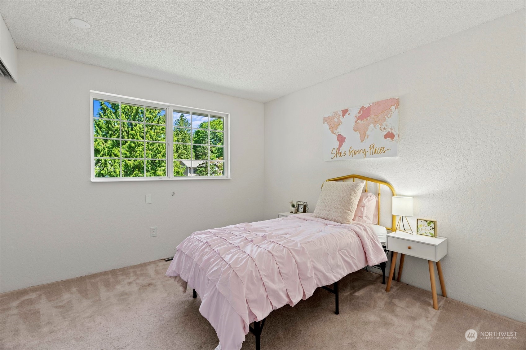 10033 Northeast 204th Street Bothell, WA 98011 - Photo 16 of 26 a bedroom with a bed and a table in it