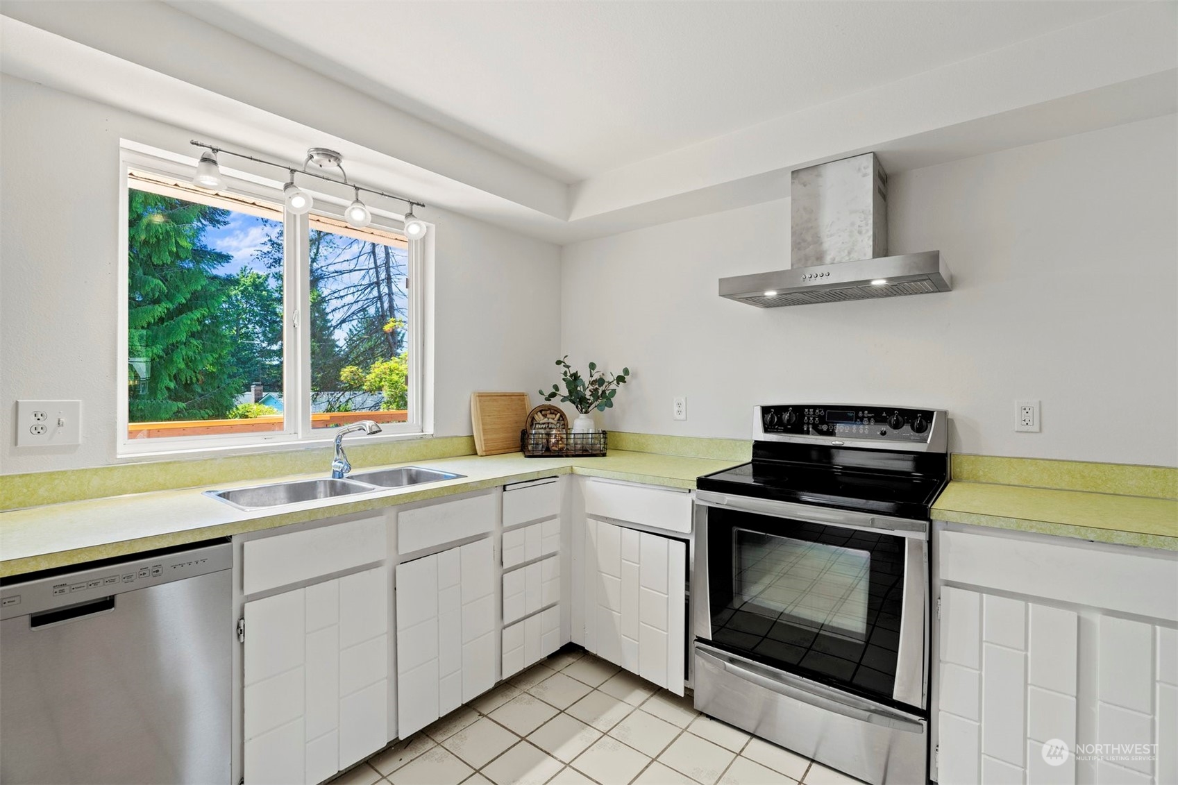 10033 Northeast 204th Street Bothell, WA 98011 - Photo 6 of 26 a kitchen with a sink stove and microwave