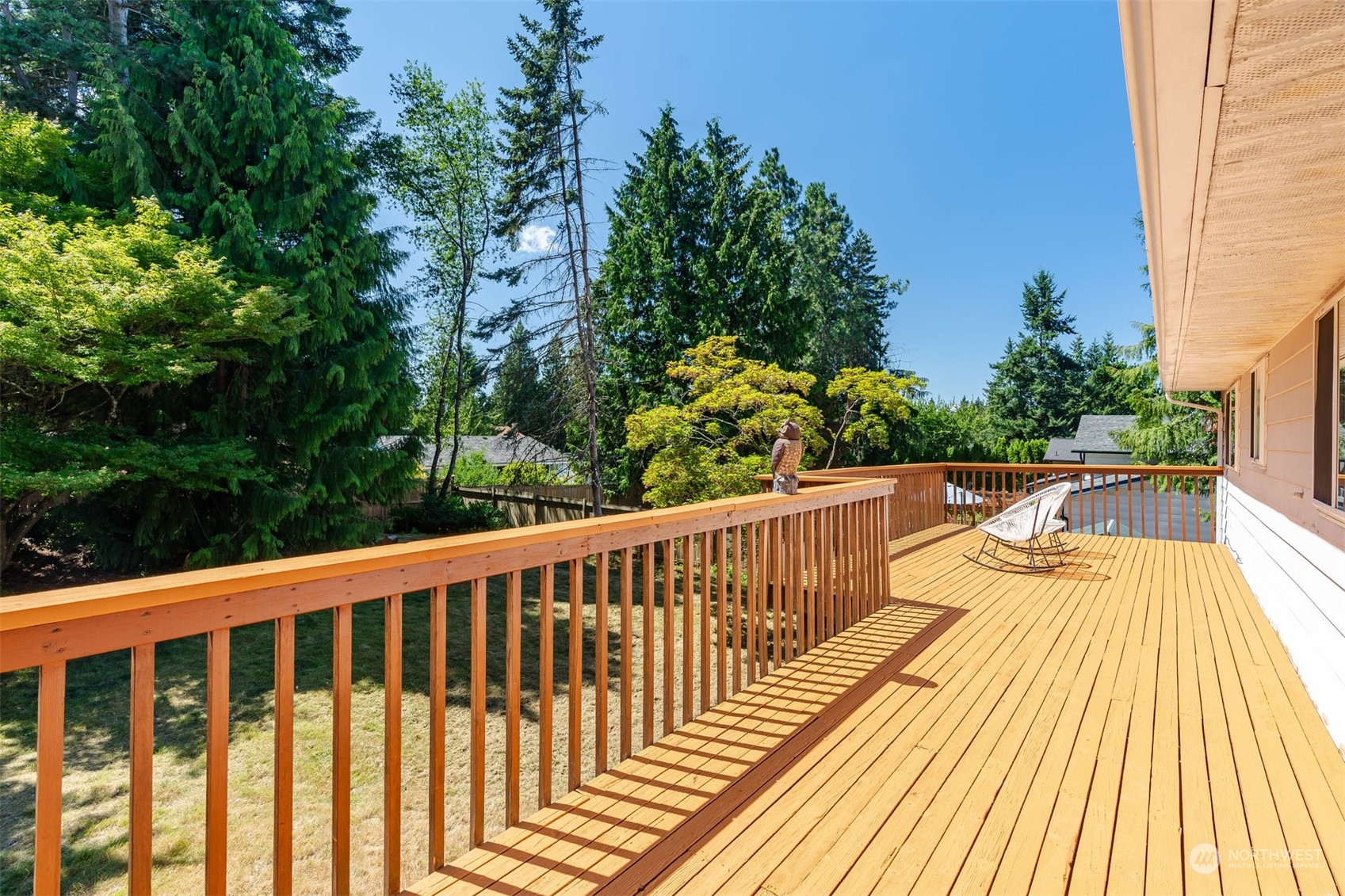 10033 Northeast 204th Street Bothell, WA 98011 - Photo 10 of 26 a view of balcony with wooden floor and fence