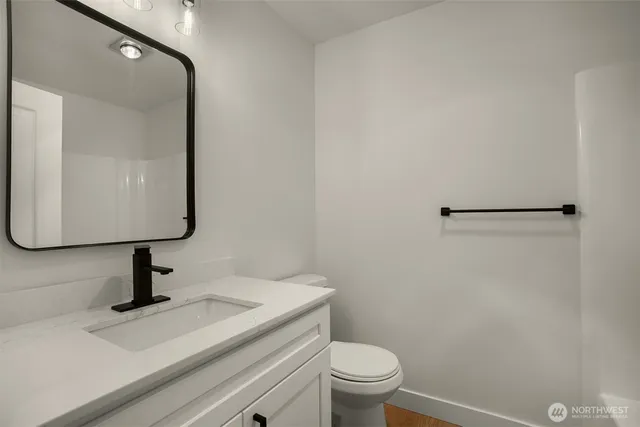 a view of bathroom with a sink and mirror