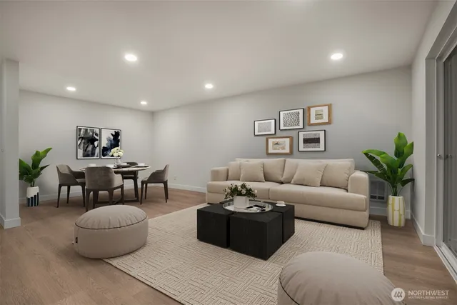 a living room with furniture and a potted plant