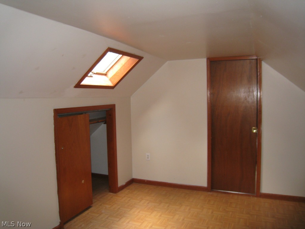4674 Liberty Road South Euclid, OH 44121 - Photo 14 of 18 Dormer bedroom with clothes closet and a skylight. Behind the closed door is an unfinished area that could be finished into a bathroom or more closet area.
