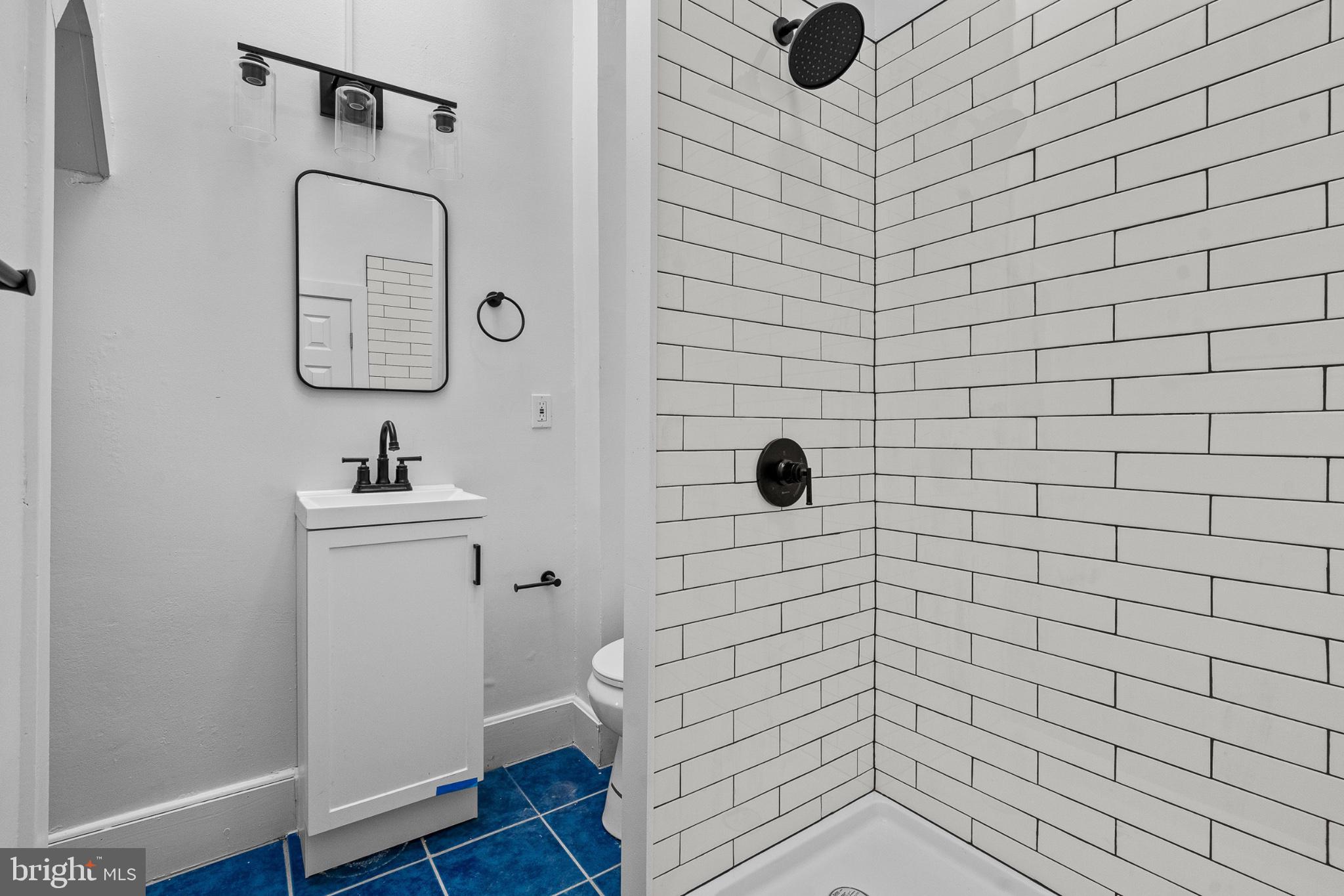 1308 West Lexington Street, Unit 3F Baltimore, MD 21223 - Photo 2 of 14 a bathroom with a toilet and a sink