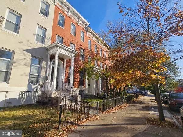 a view of a building with a yard
