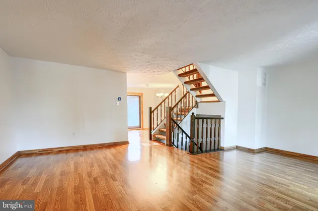 a view of an entryway with wooden floor