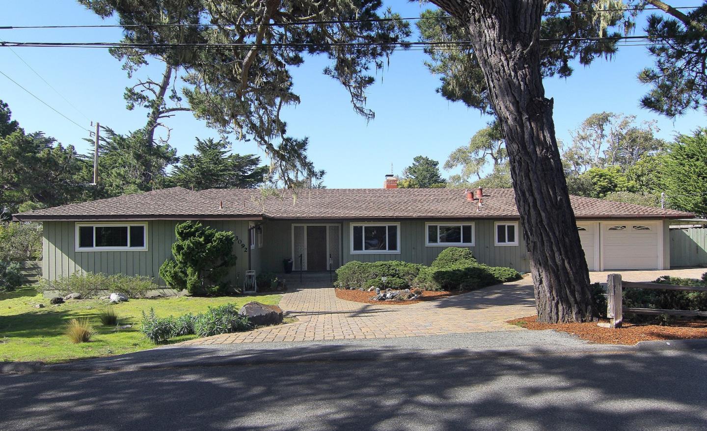 3092 Valdez Road Pebble Beach, CA 93953 - Photo 1 of 17 a front view of a house with garden