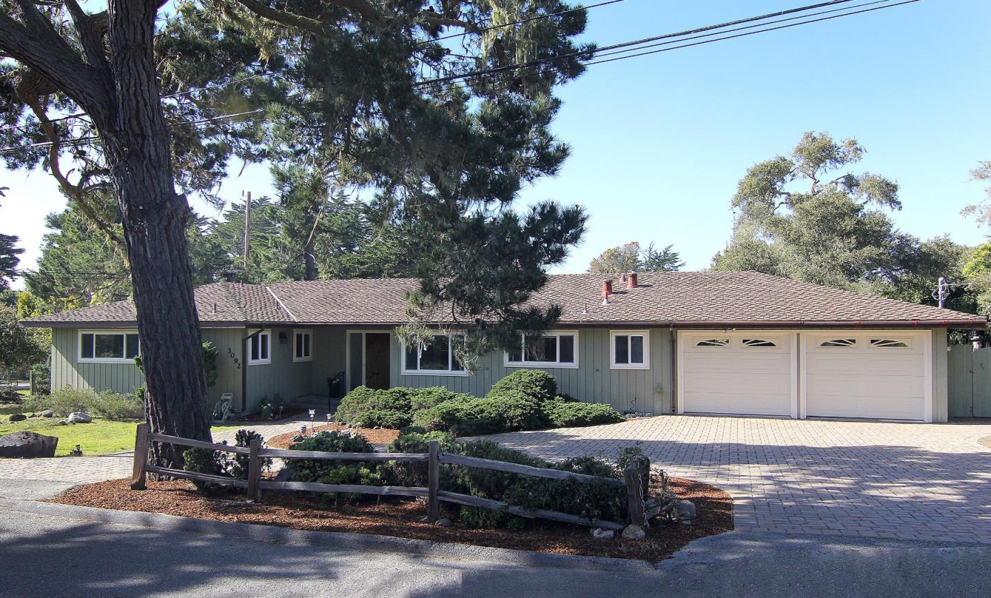 3092 Valdez Road Pebble Beach, CA 93953 - Photo 2 of 17 a front view of a house with a garden