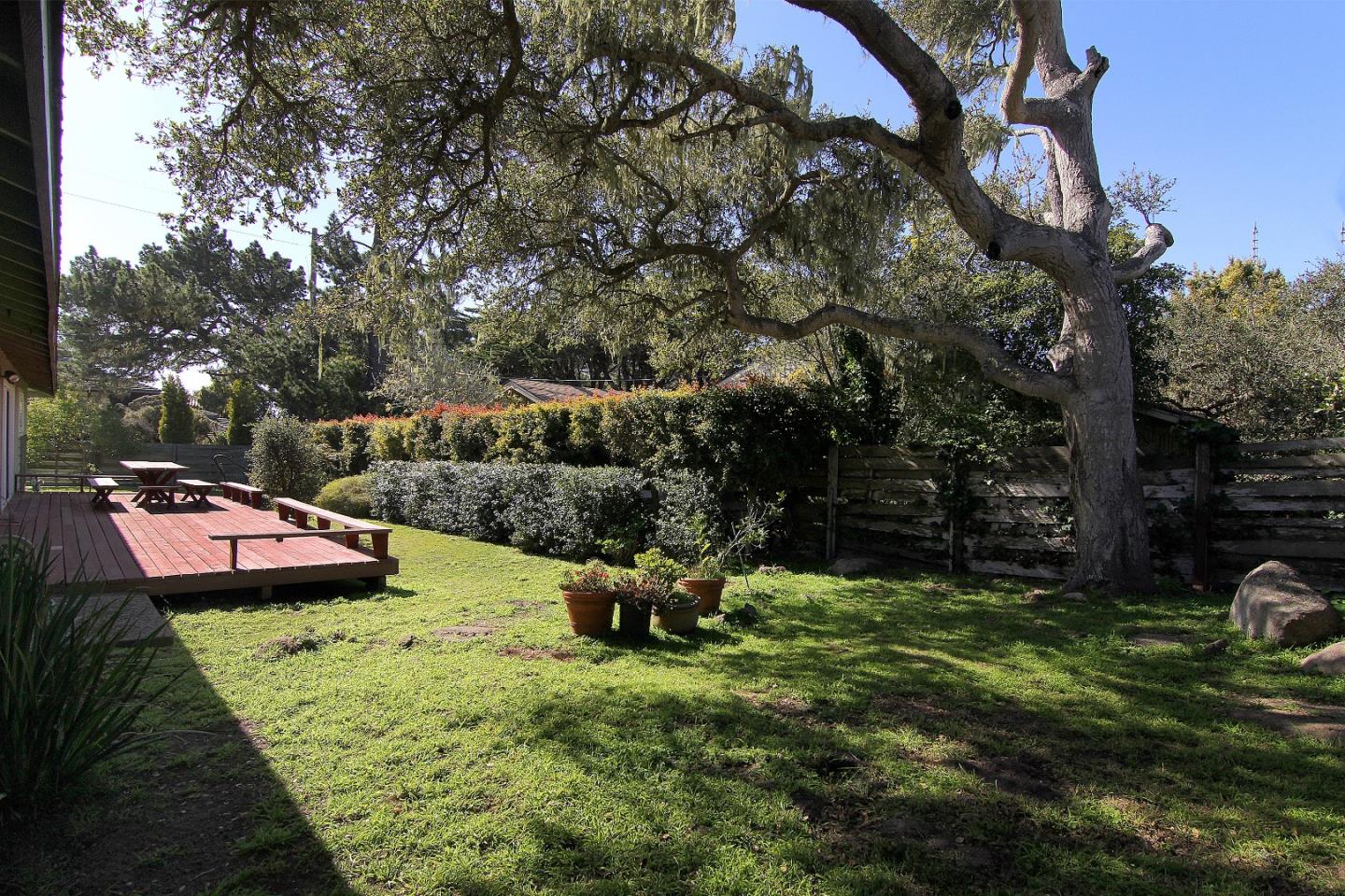 3092 Valdez Road Pebble Beach, CA 93953 - Photo 6 of 17 a backyard of a house with table and chairs