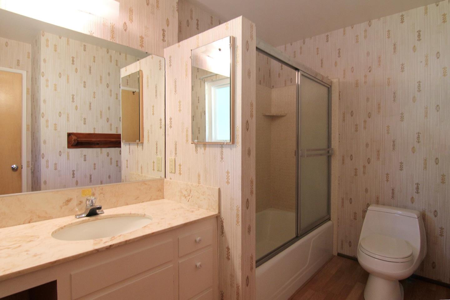 3092 Valdez Road Pebble Beach, CA 93953 - Photo 10 of 17 a bathroom with a granite countertop sink toilet and shower