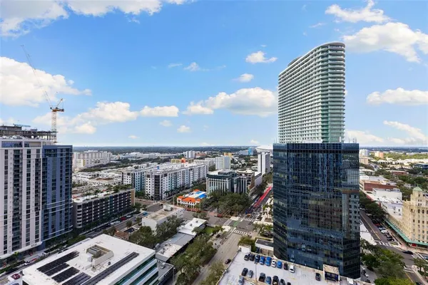 a bedroom with furniture and a potted plant