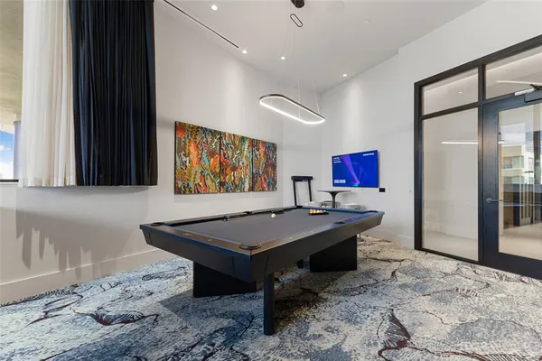 a view of a terrace with chairs and potted plants